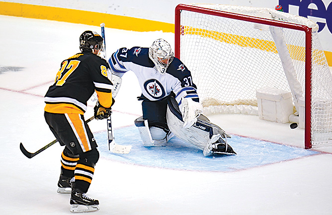Pens rally with shootout win